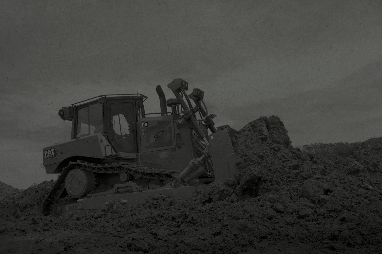 Construction bulldozer on a construction site with a dark overlay