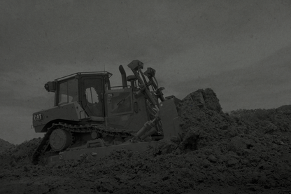 Construction bulldozer on a construction site with a dark overlay
