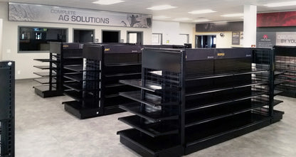 This fixture is a Lozier Showroom shelving unit designed for a Caterpillar or AGCO or Fendt or Massey dealership.