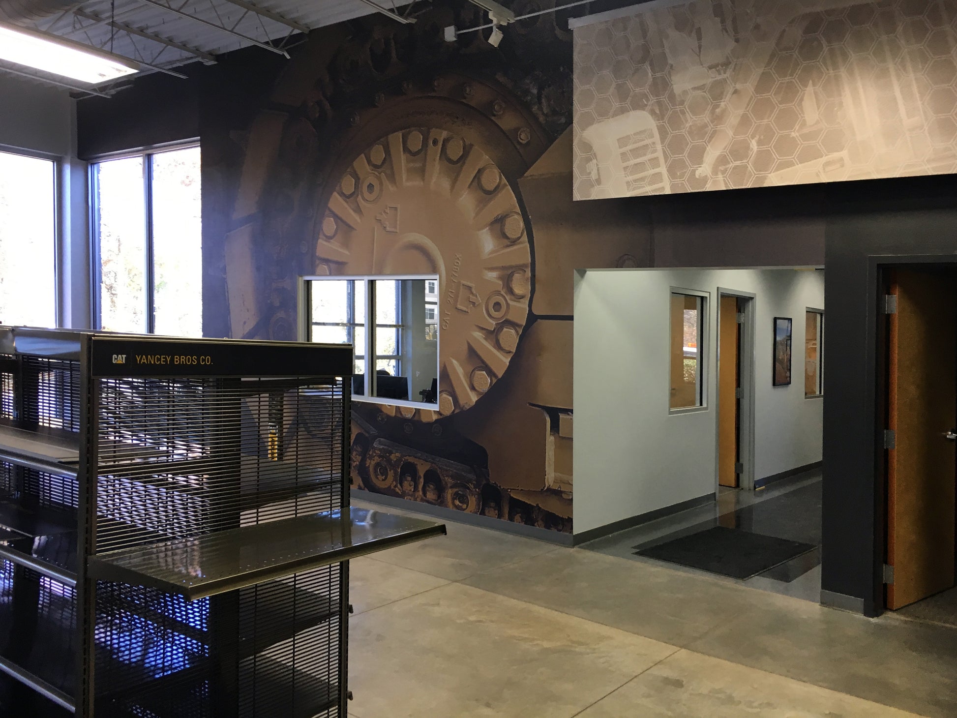Printed and installed CAT Undercarriage Closeup Mural at Yancey BCP center in Austell, Georgia.