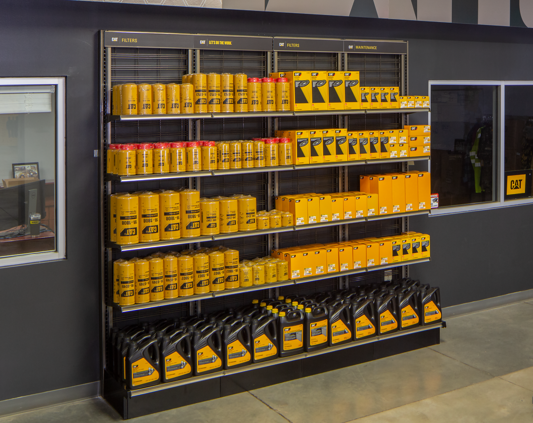 This fixture is a Lozier Showroom shelving unit designed for a Caterpillar or AGCO or Fendt or Massey dealership.